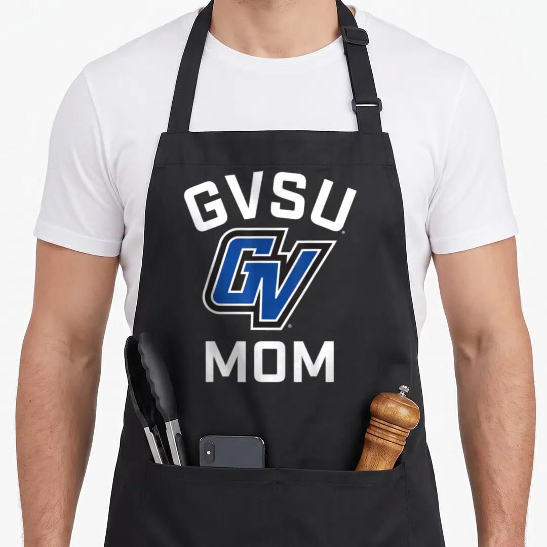 Valley lakers apron - GVSU arched text, blue GV logo, and MOM text in white and black — shown on a black cotton canvas apron against a white background