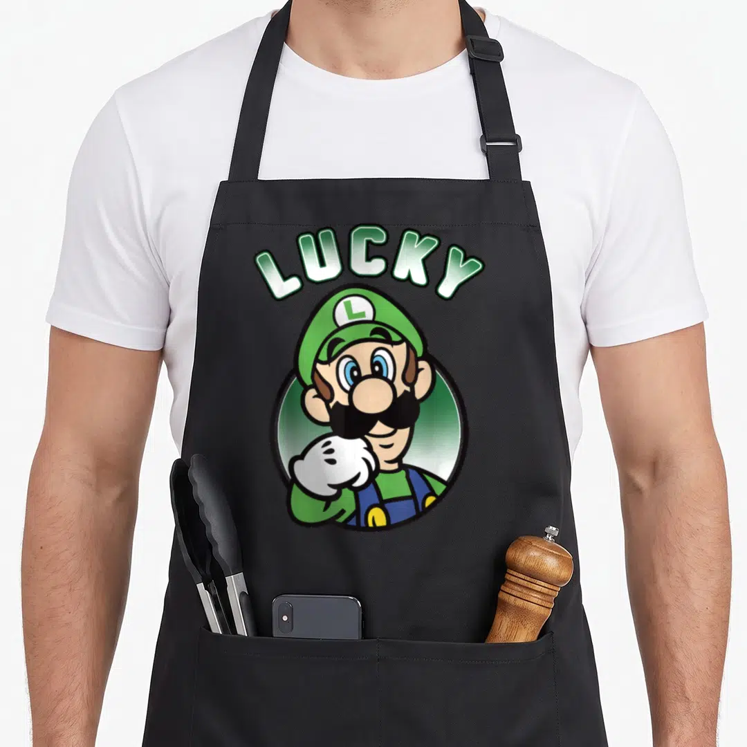 Patty lucky apron - Arched LUCKY text above cartoon Luigi in green circle frame — shown on a black cotton canvas apron against a white background