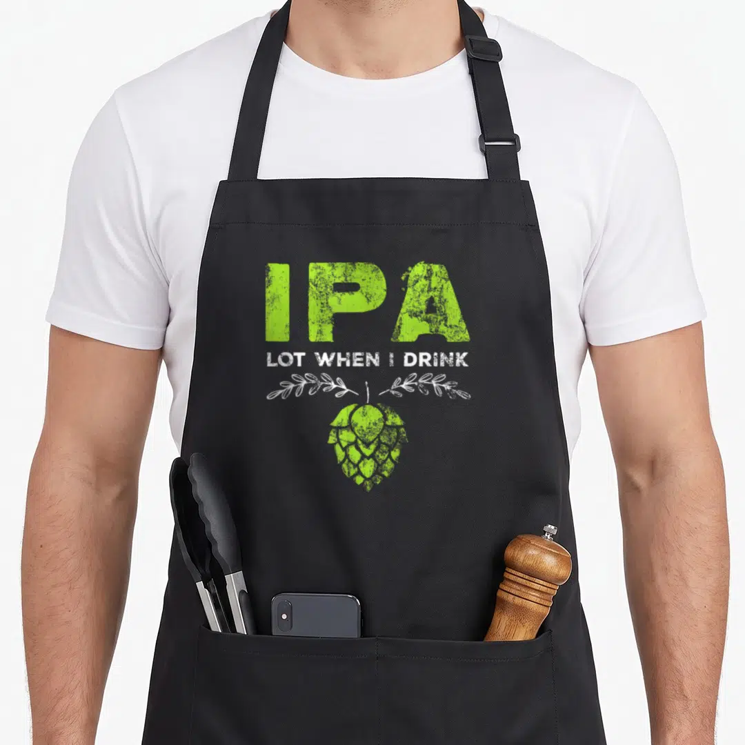 Lot beer apron - Distressed IPA text above lime green hop cone and white leaves — shown on a black cotton canvas apron against a white background