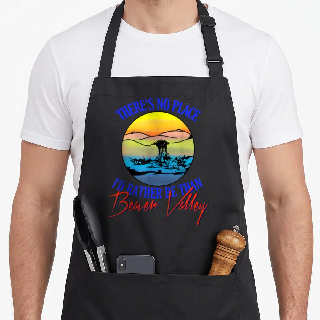 Valley beaver apron - Retro circular art with nuclear cloud and text There's No Place I'd Rather Be Than Beaver Valley — shown on a black cotton canvas apron against a white background