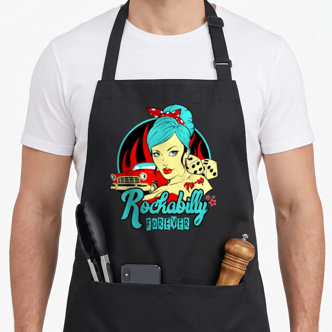 Pin rockabilly apron - Cartoon woman with blue hair, red car, dice, and red flames with Rockabilly text — shown on a black cotton canvas apron against a white background