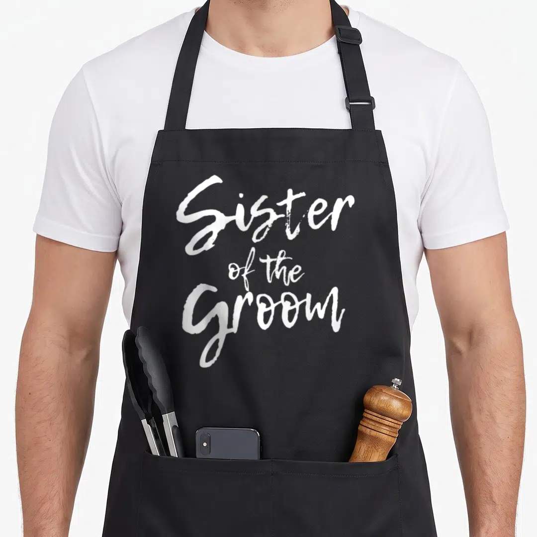 Shower bridal apron - White Sister of the Groom stacked calligraphy text design — shown on a black cotton canvas apron against a white background