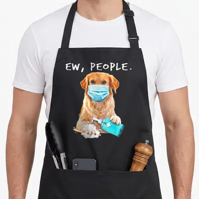 Face golden retriever apron - Golden dog in blue mask holding soap bottle under ew people text — shown on a black cotton canvas apron against a white background