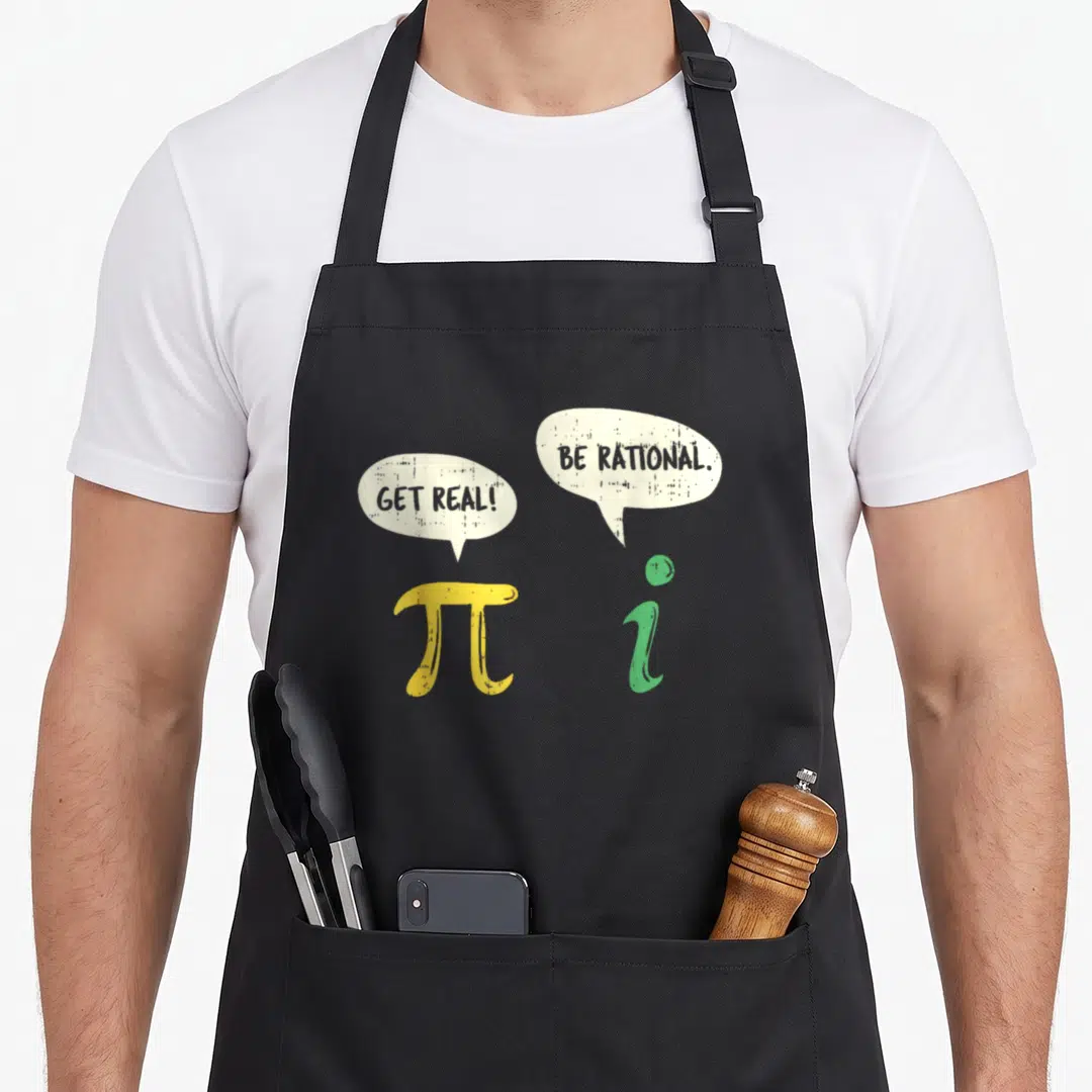 Rational teacher apron - Yellow pi and green i symbols with speech bubbles reading get real and be rational — shown on a black cotton canvas apron against a white background