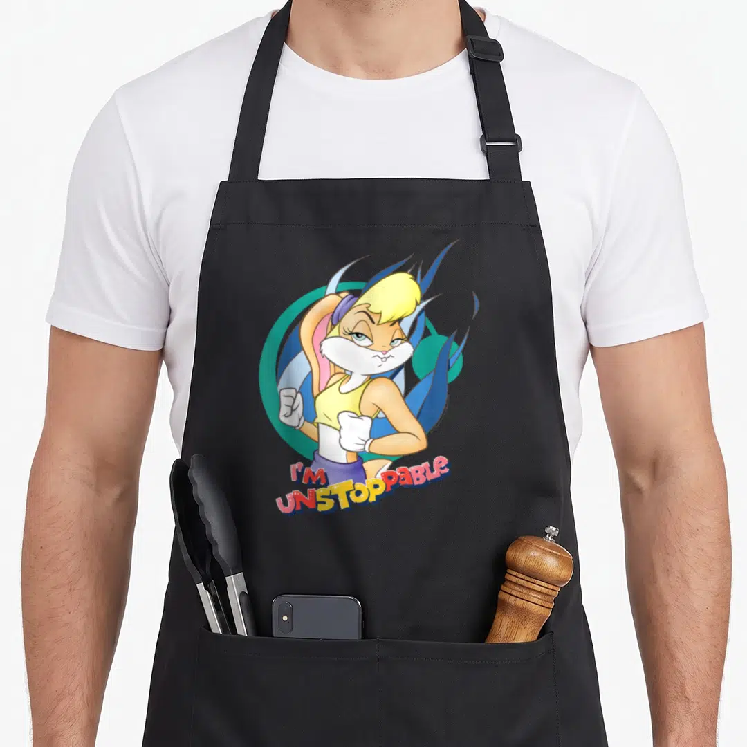 Unstoppable bunny apron - Cartoon rabbit in yellow top with blue flames and I'm Unstoppable text — shown on a black cotton canvas apron against a white background