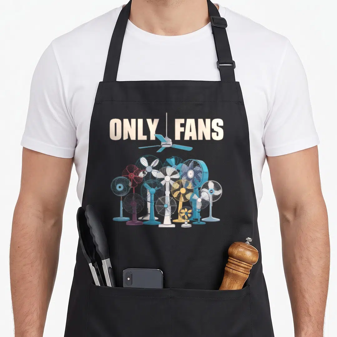 Fan joke apron - ONLY FANS text split by ceiling fan above cluster of electric fans in blue and white cartoon style — shown on a black cotton canvas apron against a white background
