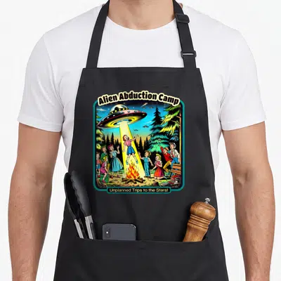 Abduction funny alien apron - Retro UFO beam lifts girl from campfire surrounded by children under Alien Abduction Camp — shown on a black cotton canvas apron against a white background