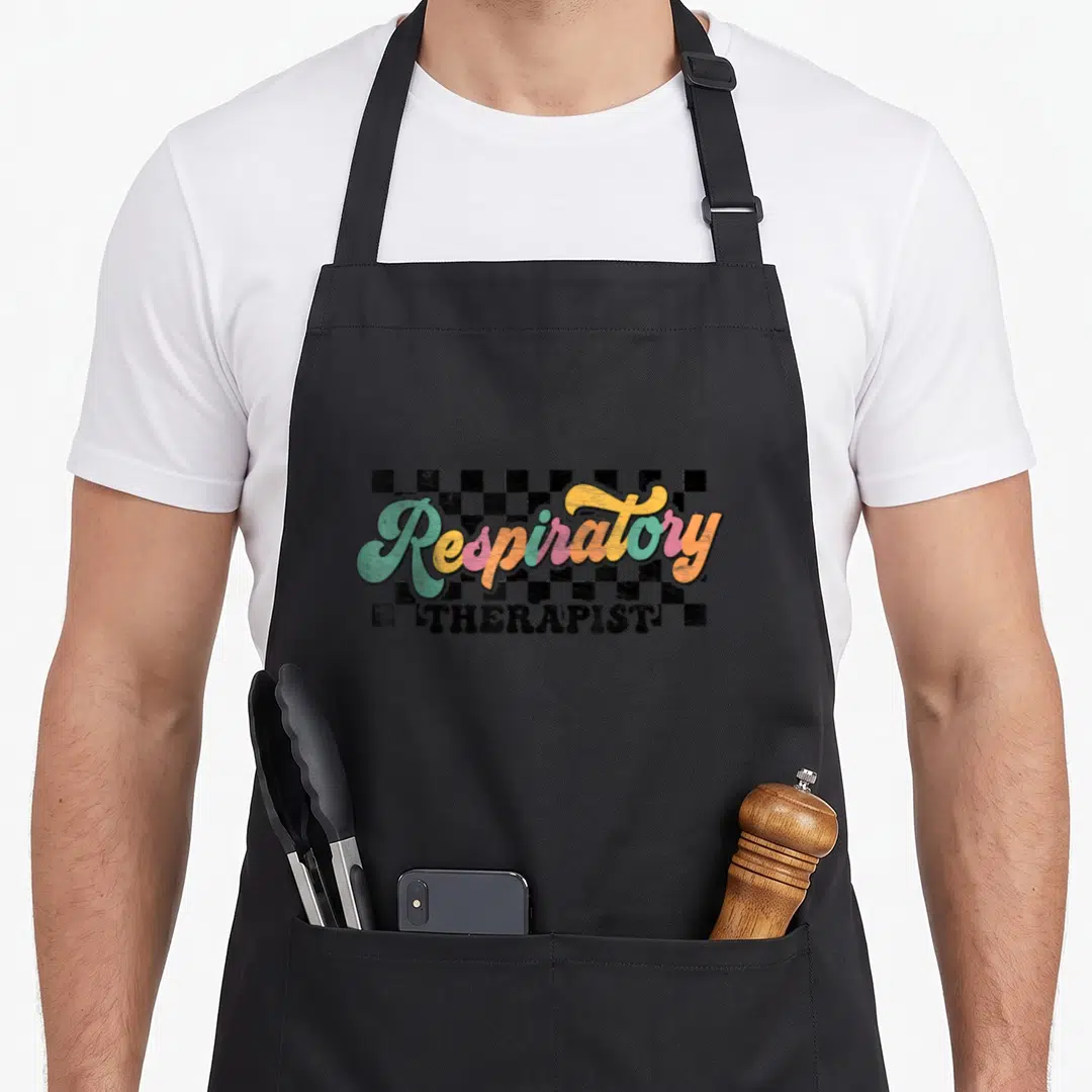Therapist nurse apron - Retro script Respiratory THERAPIST text over black white checkerboard in teal pink orange — shown on a black cotton canvas apron against a white background