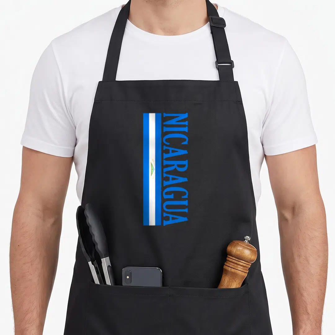 Nicaragua football apron - Vertical blue white flag stripes with NICARAGUA text running alongside — shown on a black cotton canvas apron against a white background