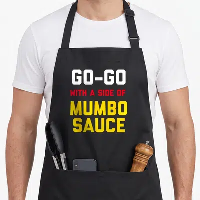 Music washington dc apron - Stacked text GO-GO WITH A SIDE OF MUMBO SAUCE in white red and yellow block letters — shown on a black cotton canvas apron against a white background