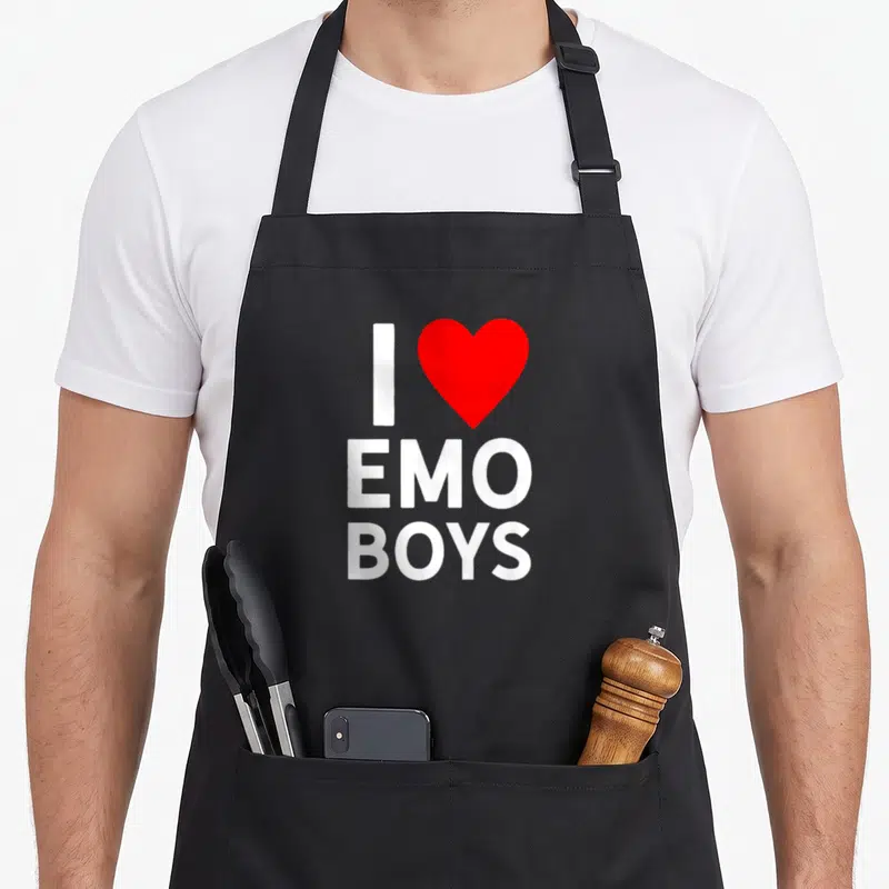 Emo trendy apron - White I and red heart above stacked EMO BOYS text — shown on a black cotton canvas apron against a white background