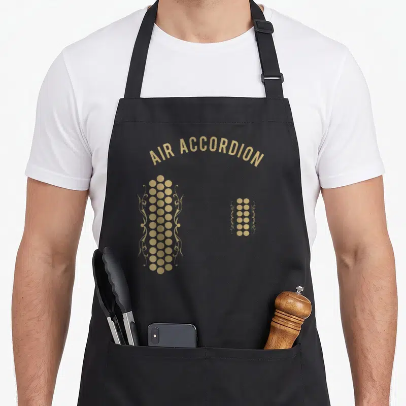 Air original accordion apron - Tan fingerprints made of dots and filigree scrolls under arched text — shown on a black cotton canvas apron against a white background