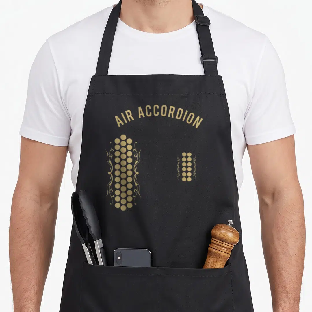 Air original accordion apron - Tan fingerprints made of dots and filigree scrolls under arched text — shown on a black cotton canvas apron against a white background