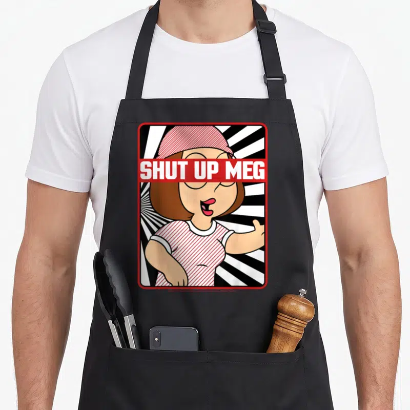 Shut novelty apron - Cartoon girl with red banner reading shut up meg over eyes against sunburst — shown on a black cotton canvas apron against a white background