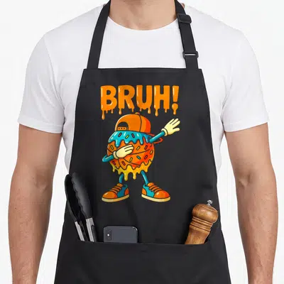 Game ice cream apron - Dripping BRUH text above a dabbing donut character in orange blue and yellow — shown on a black cotton canvas apron against a white background