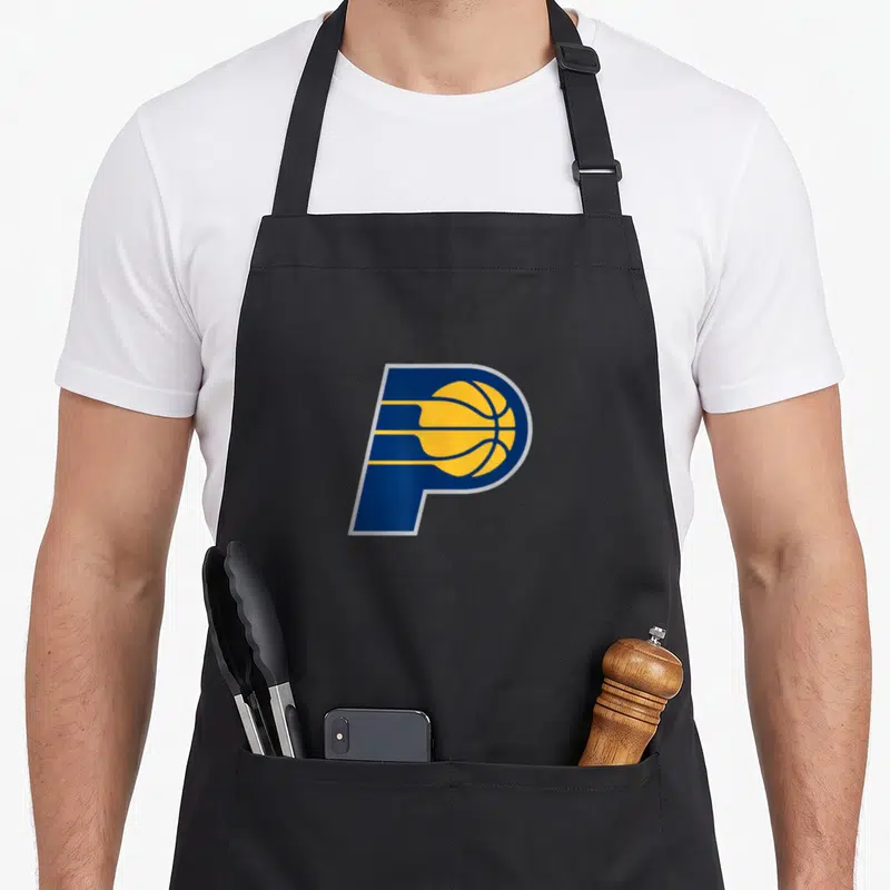 Indiana florida atlantic apron - Blue letter P containing a yellow basketball with horizontal speed lines — shown on a black cotton canvas apron against a white background
