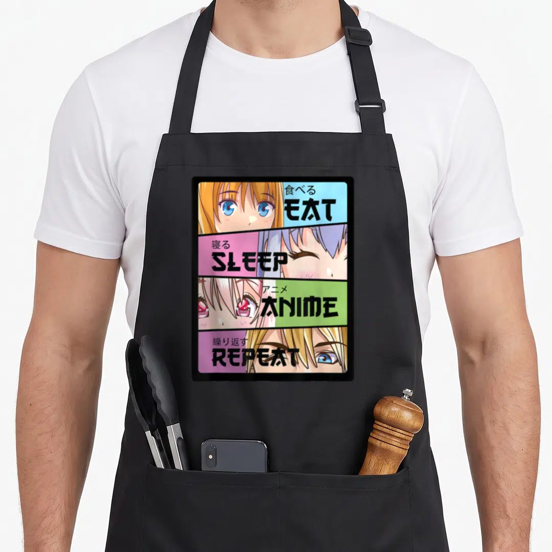 Eat kawaii cooking apron - Four-panel anime face grid with EAT SLEEP ANIME REPEAT text on blue pink green purple — shown on a black cotton canvas apron against a white background