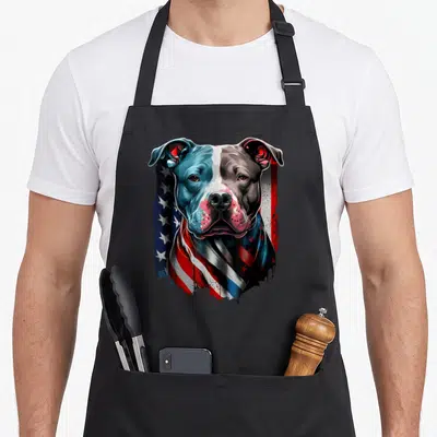 Pitbull terrier dog dad apron - Realistic pitbull head with American flag pattern in blue red white grey — shown on a black cotton canvas apron against a white background