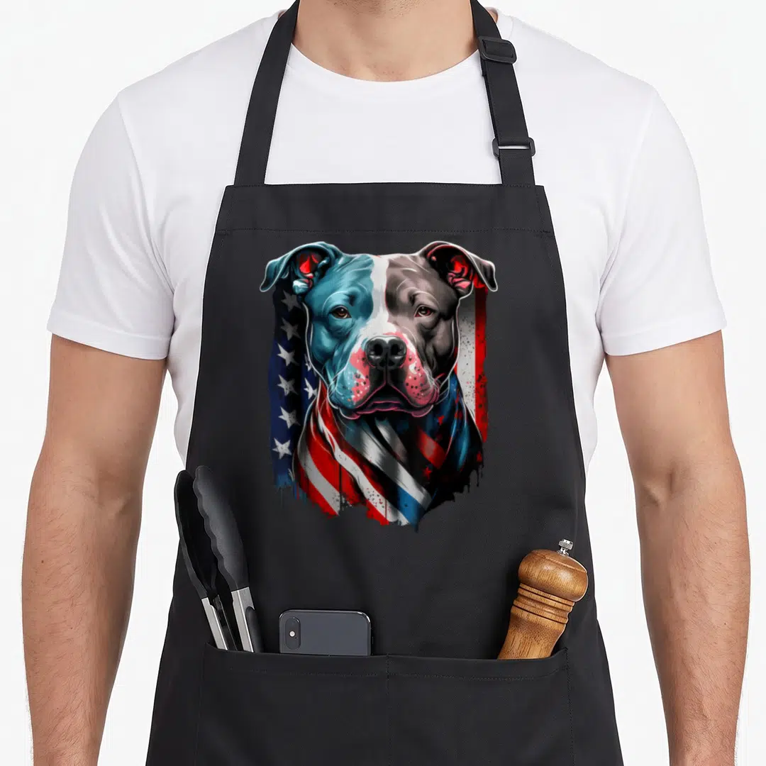 Pitbull terrier dog dad apron - Realistic pitbull head with American flag pattern in blue red white grey — shown on a black cotton canvas apron against a white background