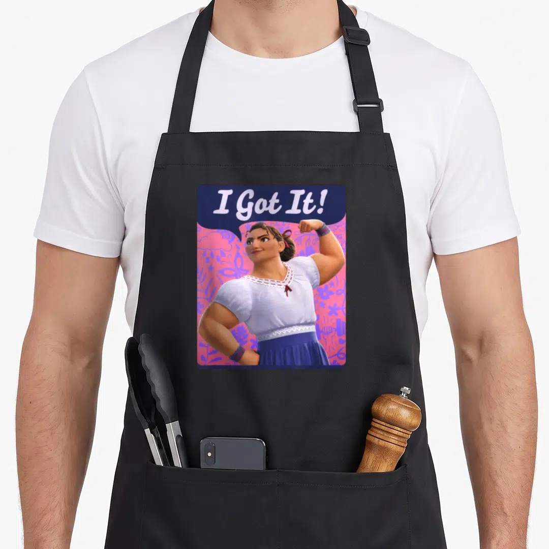 Luisa floral apron - Strong woman flexing arm under I Got It text on pink purple floral background — shown on a black cotton canvas apron against a white background