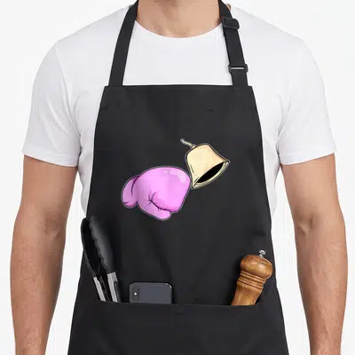 Ringing bell apron - Pink boxing glove next to a beige hand bell in cartoon style — shown on a black cotton canvas apron against a white background