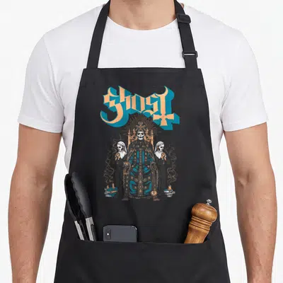 Throne ghost apron - GHOST text above skeleton pope on throne flanked by two nuns with candles and books — shown on a black cotton canvas apron against a white background