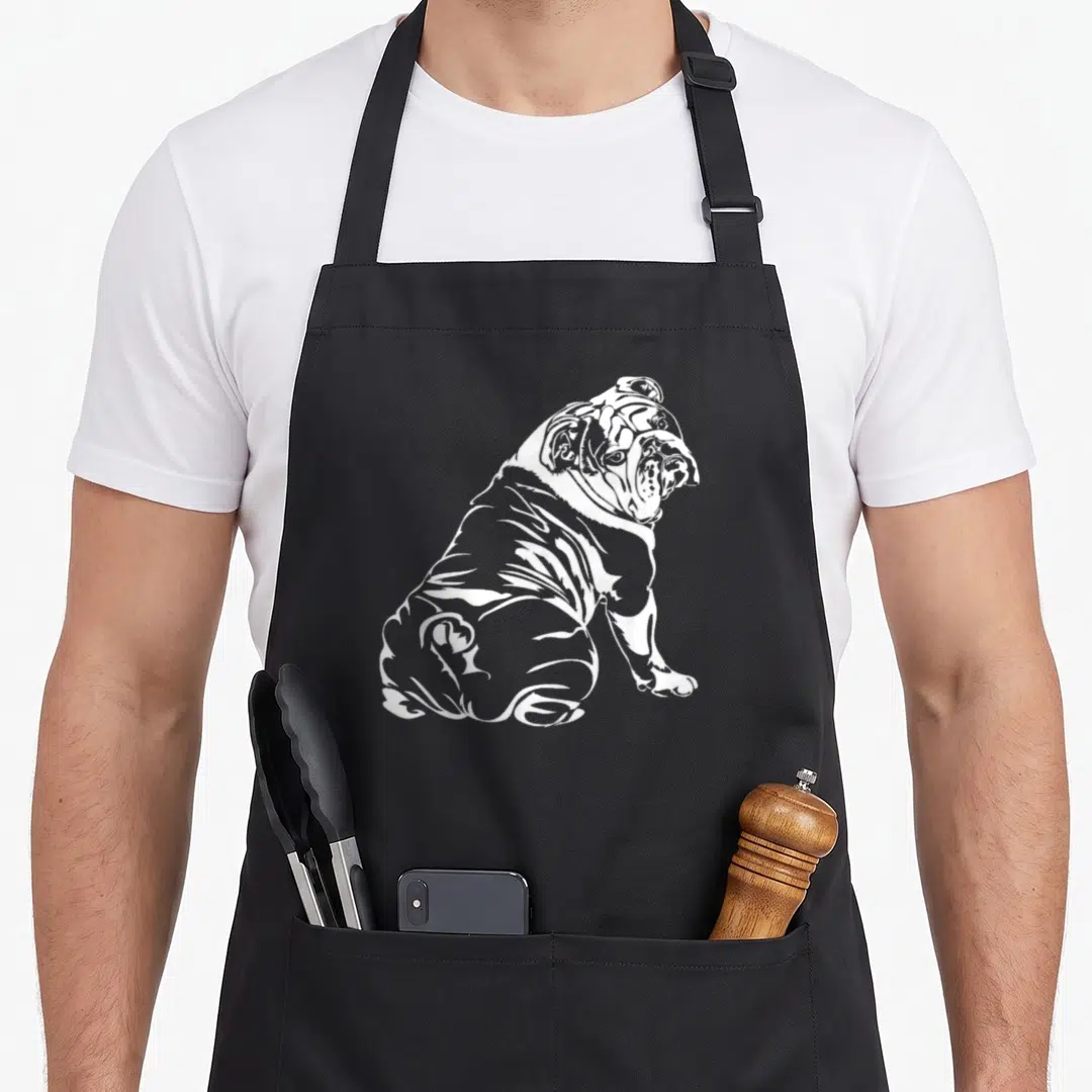 Bulldog english apron - White line art of a seated English Bulldog facing right — shown on a black cotton canvas apron against a white background