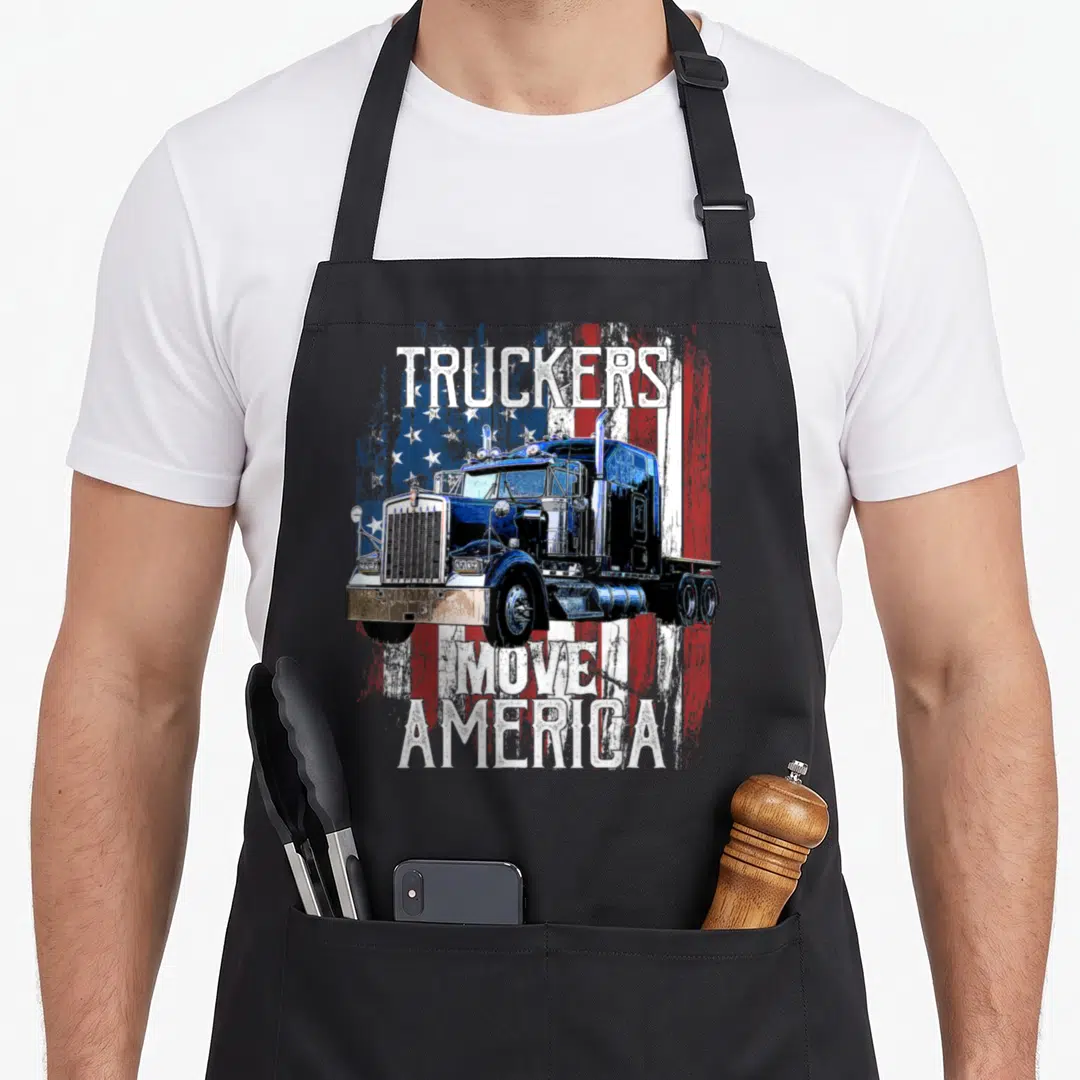 Move semi truck apron - Blue semi-truck on distressed flag with TRUCKERS MOVE AMERICA text — shown on a black cotton canvas apron against a white background
