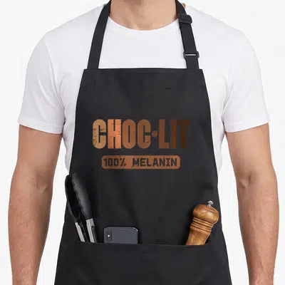 Choc african apron - CHOC-LIT 100% melanin orange brown typography design — shown on a black cotton canvas apron against a white background