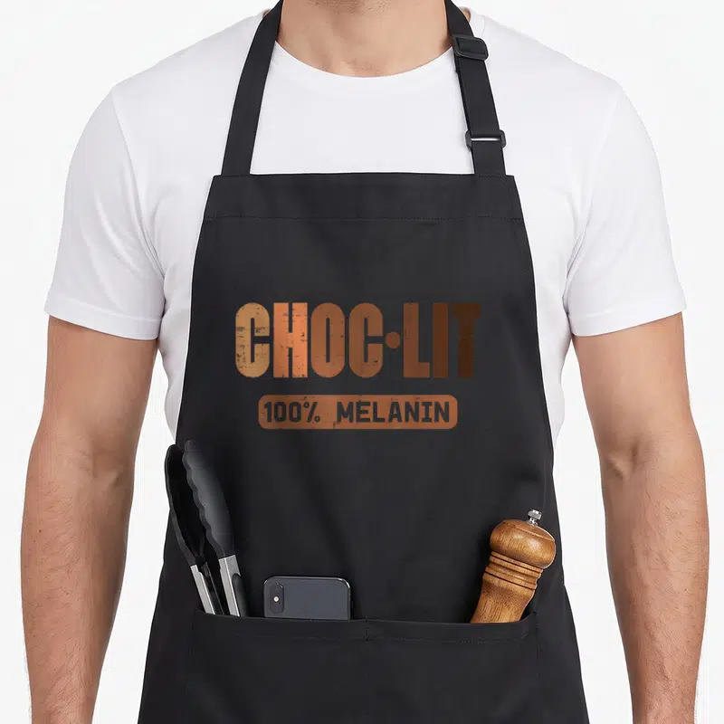 Choc african apron - CHOC-LIT 100% melanin orange brown typography design — shown on a black cotton canvas apron against a white background
