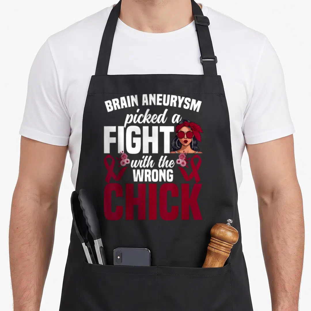 Brain survivor aneurysm awareness apron - Fighter text with woman illustration and burgundy awareness ribbons — shown on a black cotton canvas apron against a white background