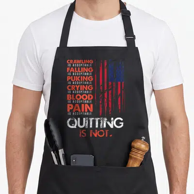 Quitting american flag apron - Stacked red and white text listing acceptable pain next to a distressed American flag — shown on a black cotton canvas apron against a white background