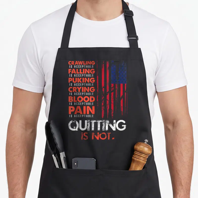 Quitting american flag apron - Stacked red and white text listing acceptable pain next to a distressed American flag — shown on a black cotton canvas apron against a white background