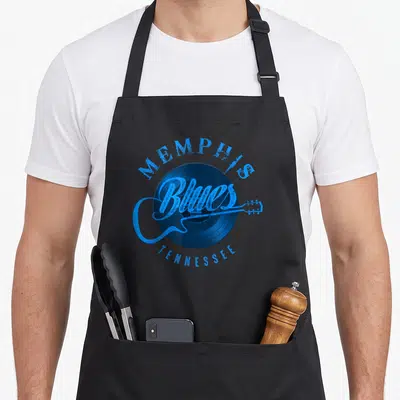 Music memphis apron - Blue vinyl record with MEMPHIS Blues TENNESSEE text and guitar silhouette — shown on a black cotton canvas apron against a white background