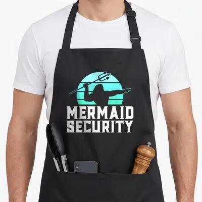 Water mermaid apron - Triton silhouette with trident against striped sun and MERMAID SECURITY text — shown on a black cotton canvas apron against a white background