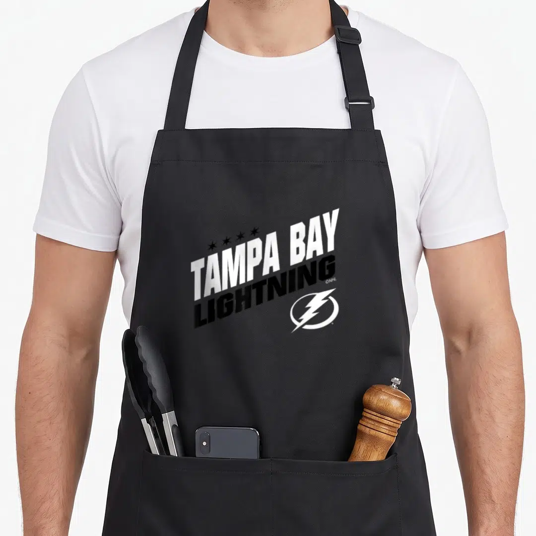 Bay fuel apron - Slanted TAMPA BAY LIGHTNING text with four stars and lightning bolt logo in white and black — shown on a black cotton canvas apron against a white background