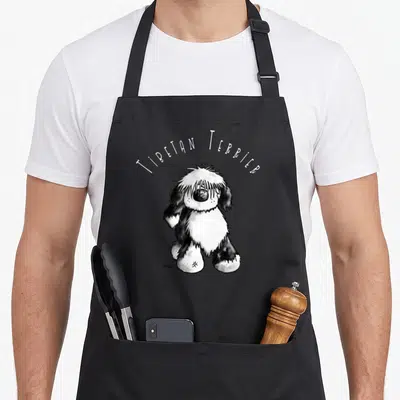 Lovely tibetan apron - Cartoon Tibetan Terrier with arched text in white and black — shown on a black cotton canvas apron against a white background
