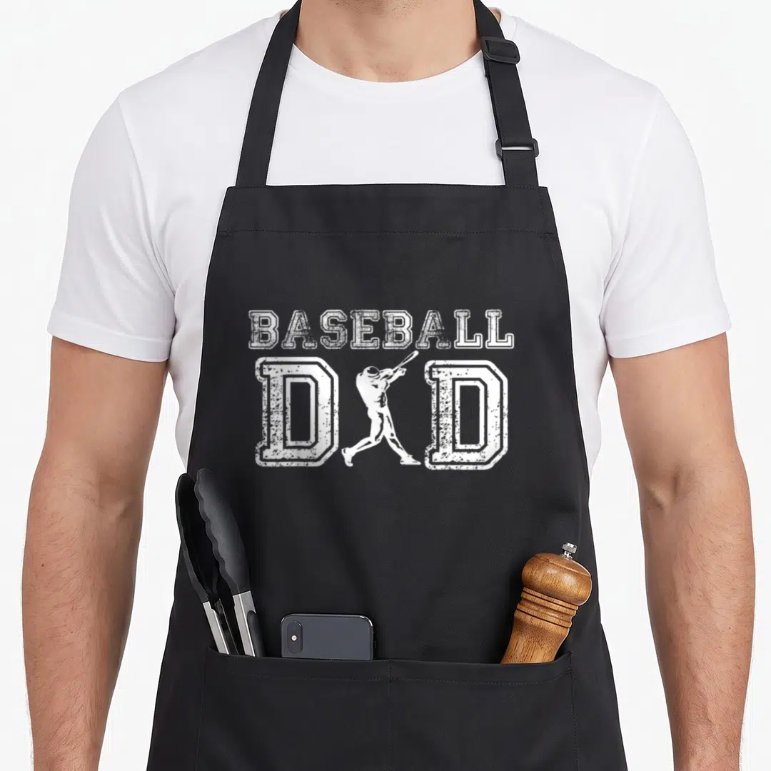 Baseball grill daddy apron - White distressed baseball dad text with batter silhouette between the Ds — shown on a black cotton canvas apron against a white background