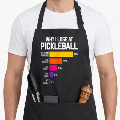 Lose pickleball apron - Bar chart listing pickleball loss reasons with yellow, orange, pink, purple, and blue bars — shown on a black cotton canvas apron against a white background