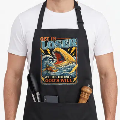 Loser funny christian apron - Vintage poster style print of Jonah swimming from open whale mouth with Get In Loser text — shown on a black cotton canvas apron against a white background