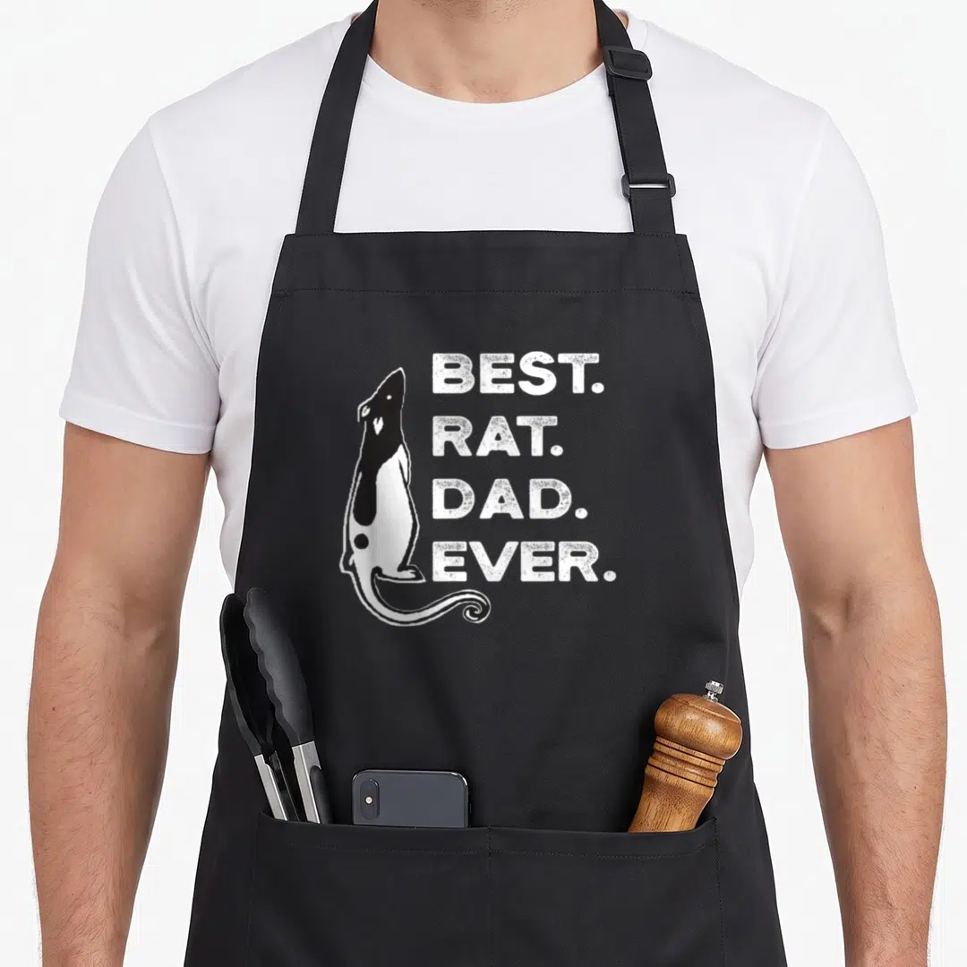 Funny rat dad apron - Black and white rat silhouette next to stacked text BEST. RAT. DAD. EVER — shown on a black cotton canvas apron against a white background