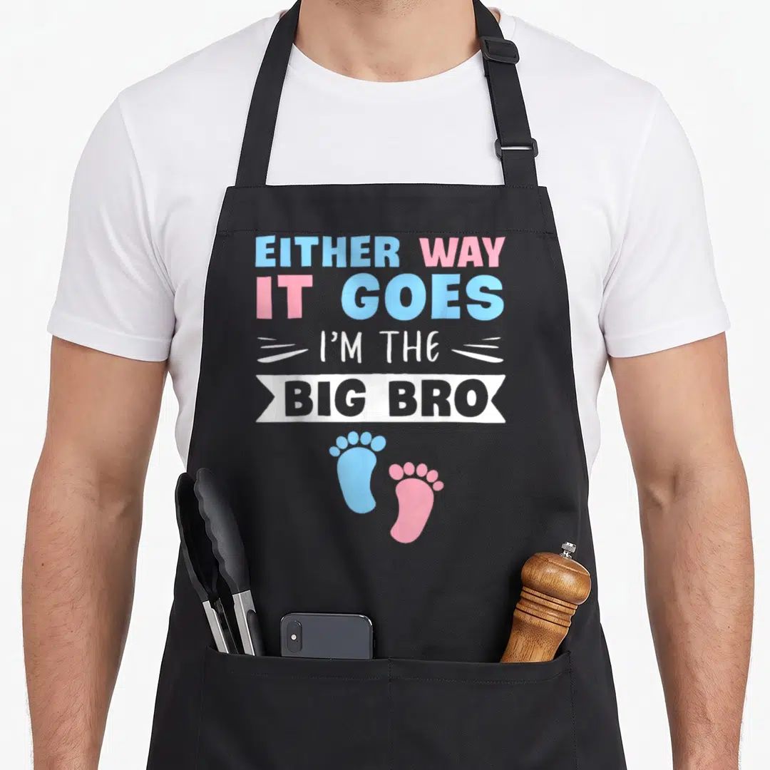 Either big brother apron - Stacked text with blue and pink baby footprints and white banner reading BIG BRO — shown on a black cotton canvas apron against a white background