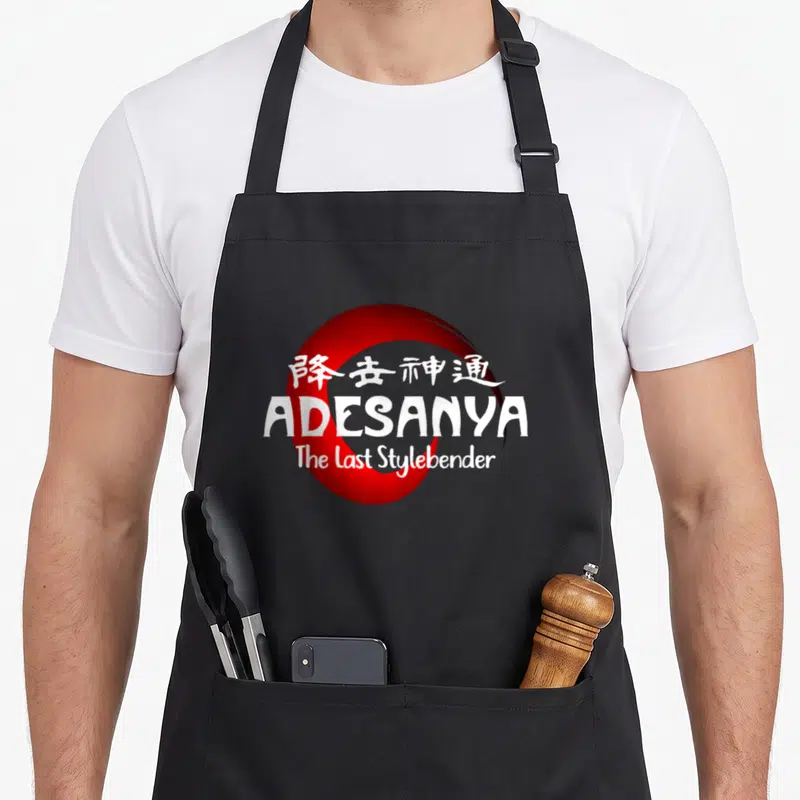 Bender fighter apron - White ADESANYA text and Chinese characters over a large red circle graphic — shown on a black cotton canvas apron against a white background