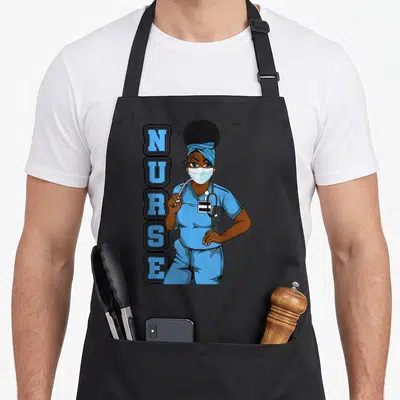 Uniform nurse apron - Vertical NURSE text beside a cartoon Black female nurse in blue scrubs and face mask — shown on a black cotton canvas apron against a white background