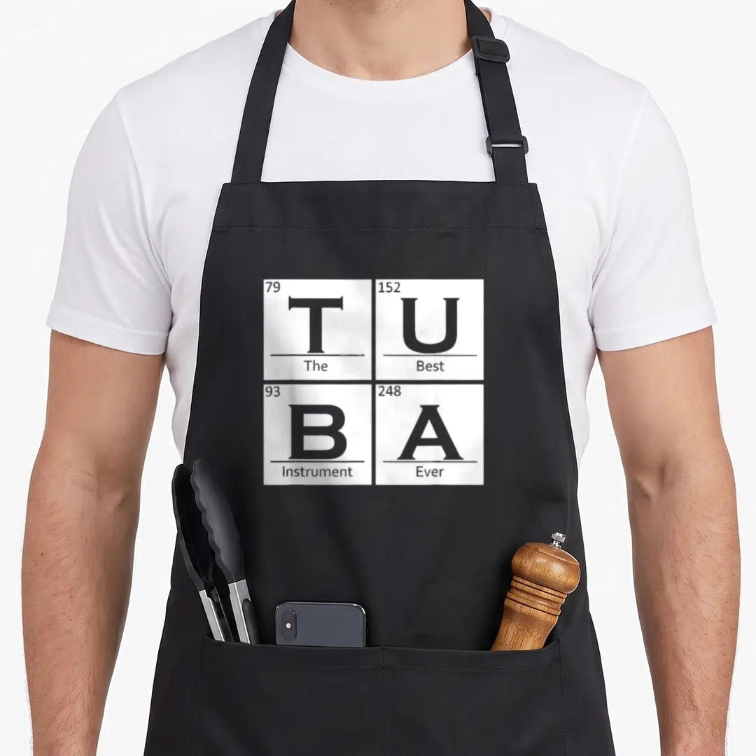 Tuba chemistry apron - Four white tiles with grey letters TUBA and numbers 79 152 93 248 — shown on a black cotton canvas apron against a white background