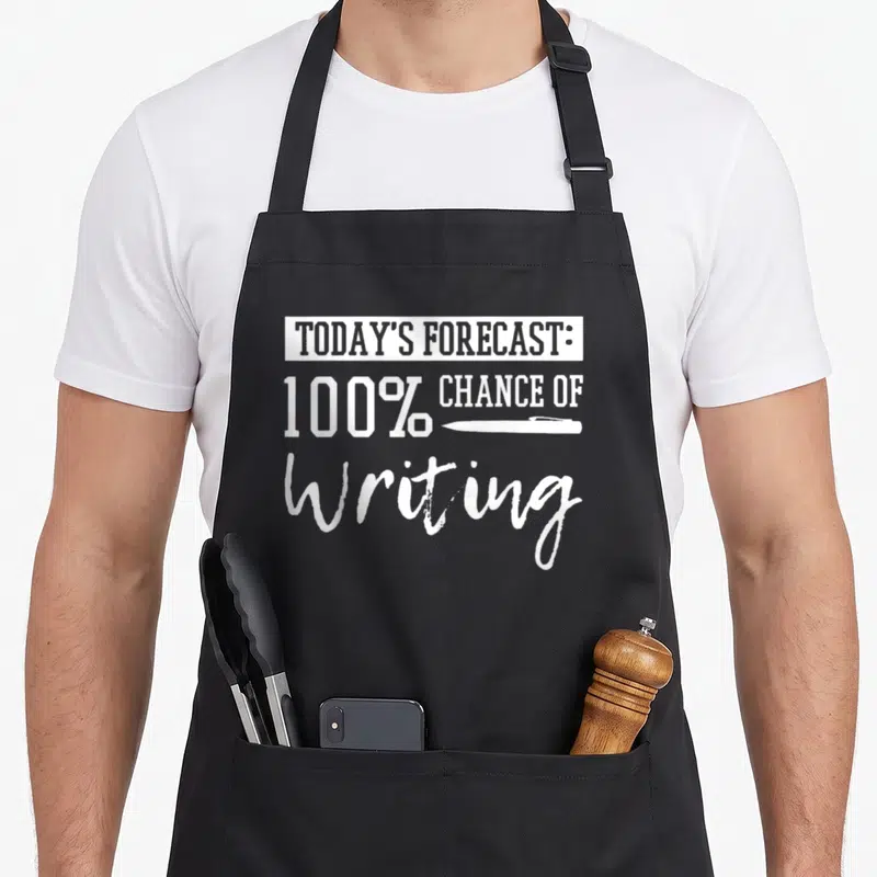 Author teacher apron - White text reading TODAY'S FORECAST 100% CHANCE OF Writing with a pen icon — shown on a black cotton canvas apron against a white background