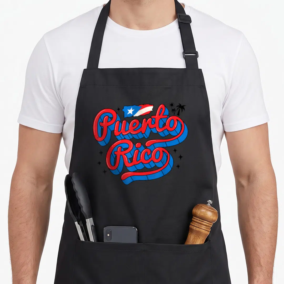 Month hispanic aprons - Retro 3D Puerto Rico text with flag map and palm trees in red blue white — shown on a black cotton canvas apron against a white background