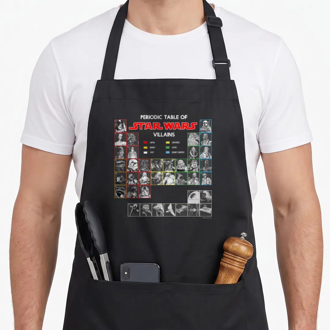 Periodic villain table apron - Star Wars villains grid with empire droids ships creatures aliens bounty hunters color — shown on a black cotton canvas apron against a white background