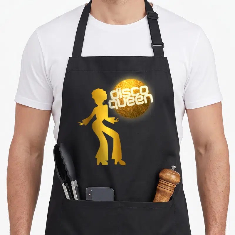 Seventy ball 70s apron - Gold woman silhouette next to glitter disco ball with white neon text — shown on a black cotton canvas apron against a white background
