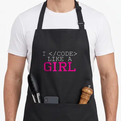 Code i love figure apron - White and pink stacked text reading I CODE LIKE A GIRL with HTML tags — shown on a black cotton canvas apron against a white background